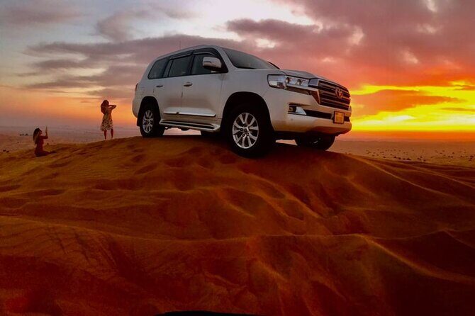 Dubai Dune Bashing with Camel Ride, Sandboarding & BBQ Dinner - From City Pickup to the Desert’s First Big Turn
