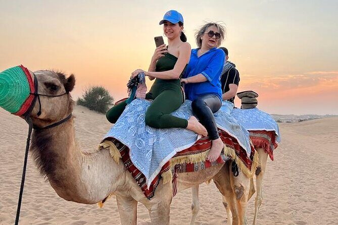 Dubai Dune Bashing with Camel Ride, Sandboarding & BBQ Dinner - Camel Ride and Sandboarding: Two Ways to Experience the Dunes
