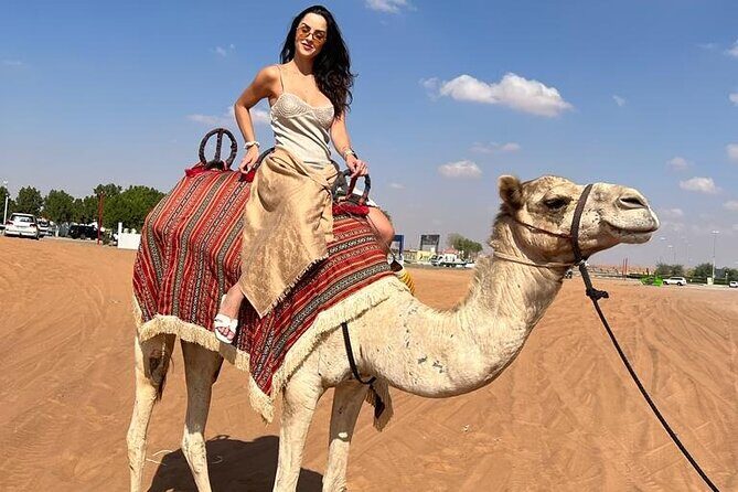 Dubai Dune Bashing with Camel Ride, Sandboarding & BBQ Dinner - Bedouin-Style Camp Dinner: BBQ, Tea, and Multiple Live Shows