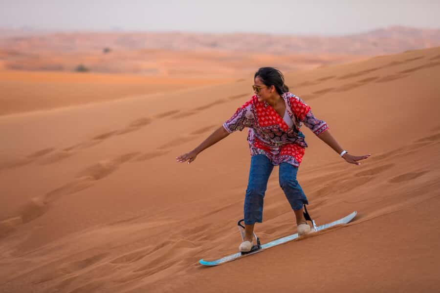 Dubai: Dune Buggy Desert Safari, Camel Ride & Sandboarding - Sandboarding After the Buggy: Quick, Physical, and Surprisingly Addictive