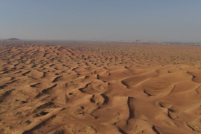 Dubai: Dune Buggy Safari and Camel Ride with Transportation - Base camp stop: AC, views, sandboarding, and practical comfort