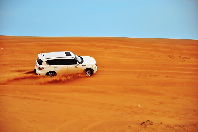Dubai Evening 4x4 Desert Safari ATV Bike ,Camel Ride , BBQ Dinner - Live shows: Tanura, belly dance, fire, and Al Ayyala