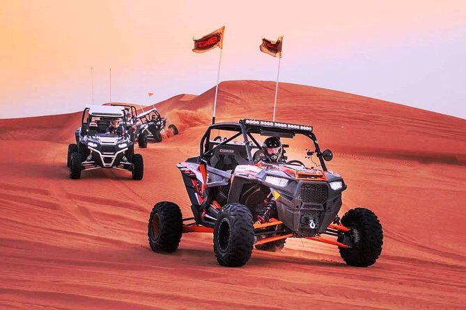 Dubai Evening Desert Dune Buggy With Buffet Dinner - Campsite arrival at sunset: fire, photos, and performance energy