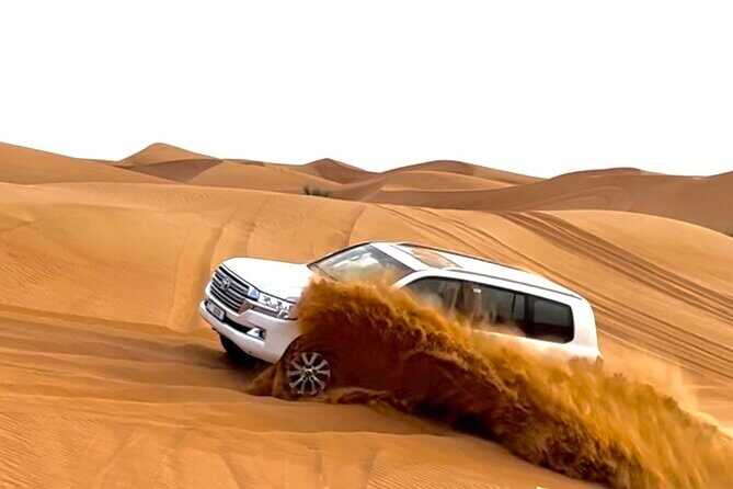 Dubai Evening Desert Safari With Quad Bike and BBQ Dinner - The camp night: BBQ dinner, Tanoura, and belly dancing