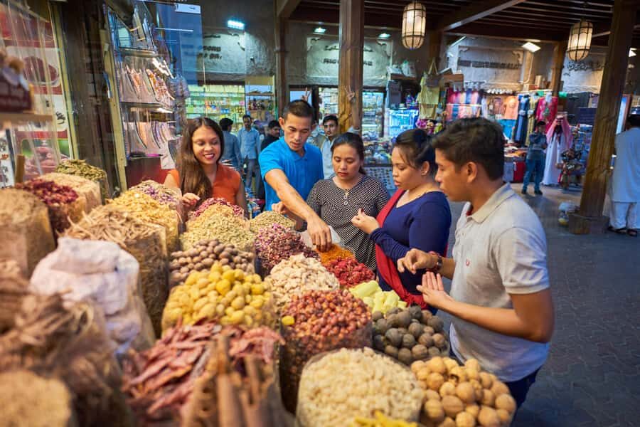 Dubai: Flavors of Arabia Souk Tour with Tastings & Dinner - Spice Souk: Where the Tour Begins With Tea, Dates, and Smell