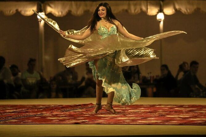 Dubai Fort Lisaili Desert Experience: Camel Ride, BBQ & Transfers - The night show: Tanoura, belly dancing, and a fire show