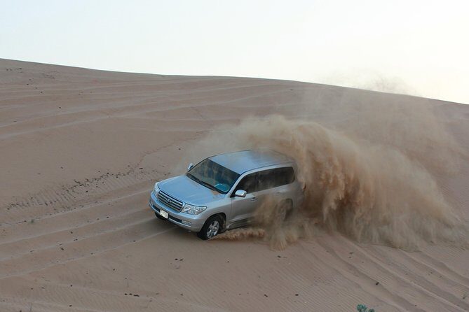 Dubai High Red Dunes Extreme Desert Safari Adventure with BBQ Dinner - Arriving at the Desert Camp: Where the Evening Becomes More Than a Ride