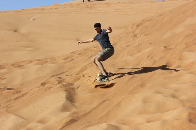 Dubai: Jeep Desert Safari, Camel Ride, and Quad Bike Tour - Sandboarding: a dune slide session with photo moments