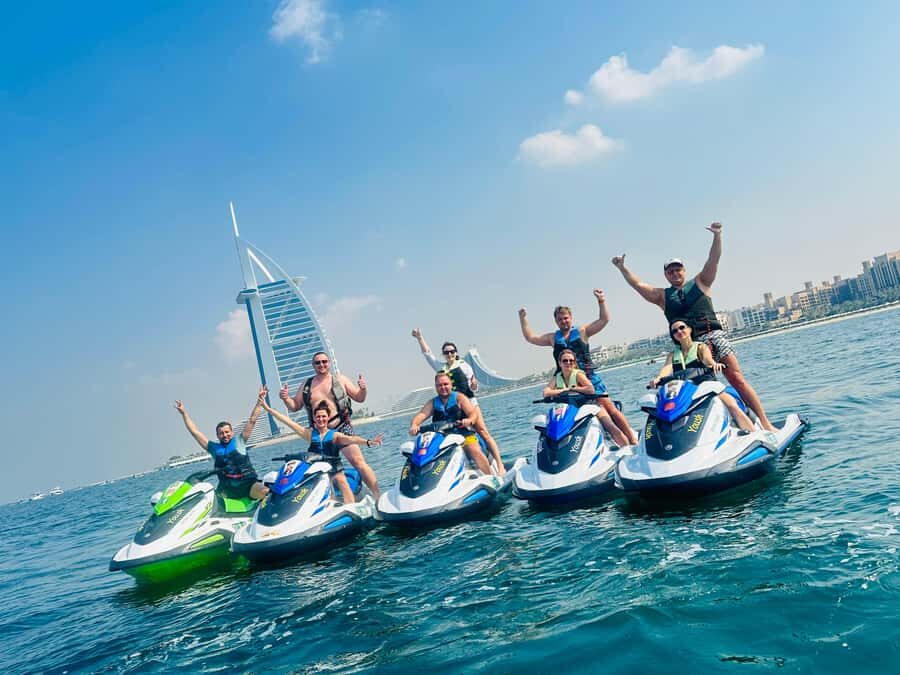 Dubai: Jet ski & Flyboard in Dubai Free Ice Cream - Flyboard 50 Meters From the Beach: One Person Flies, Others Watch