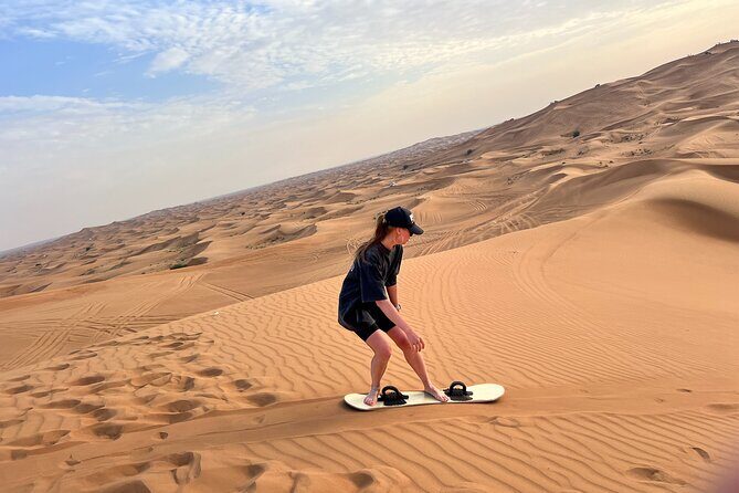 Dubai Morning Desert Safari Red Dune Camel Falcon & Sandboarding - Dubai hotel pickup to Lahbab in a 4x4 Land Cruiser