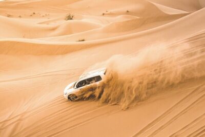Dubai: Morning Desert Safari with Camel Ride & Sandboarding - Getting out to the dunes: pickup, timing, and the vibe shift