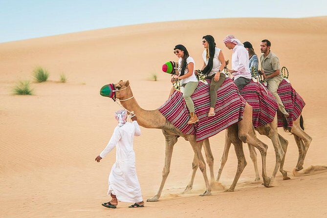 Dubai Morning Safari: Quad Biking, Sandboarding & Camel Ride! - Sandboarding Down the Dunes