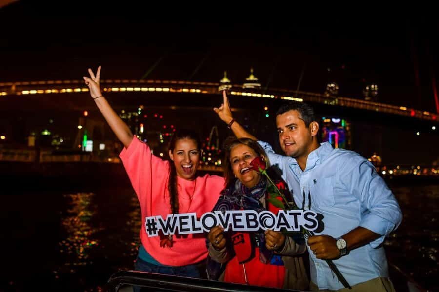 Dubai - New Year's Eve Fireworks show on a Speedboat - The night landmarks: Atlantis, Burj Al Arab, and Burj Khalifa from the water