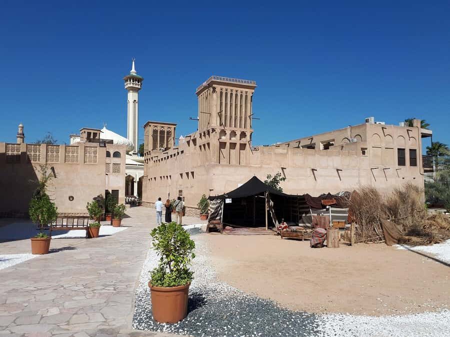Dubai: Old City Walking Tour with Abra Ride - Al Fahidi Fort and the textile market: trading-town details