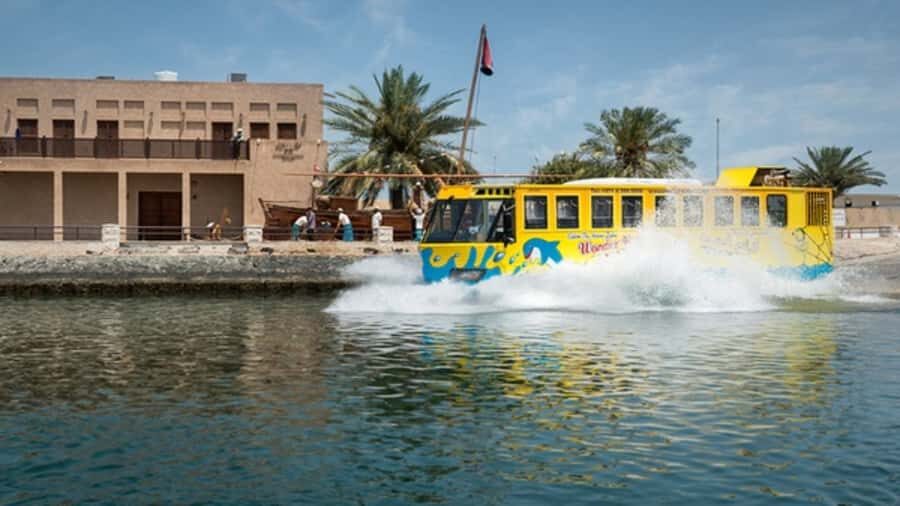Dubai: Old town tour with Wonder Bus, souks, Creek and Guide - Dubai Creek transfer: abra boats, old wooden ships, and the splash moment