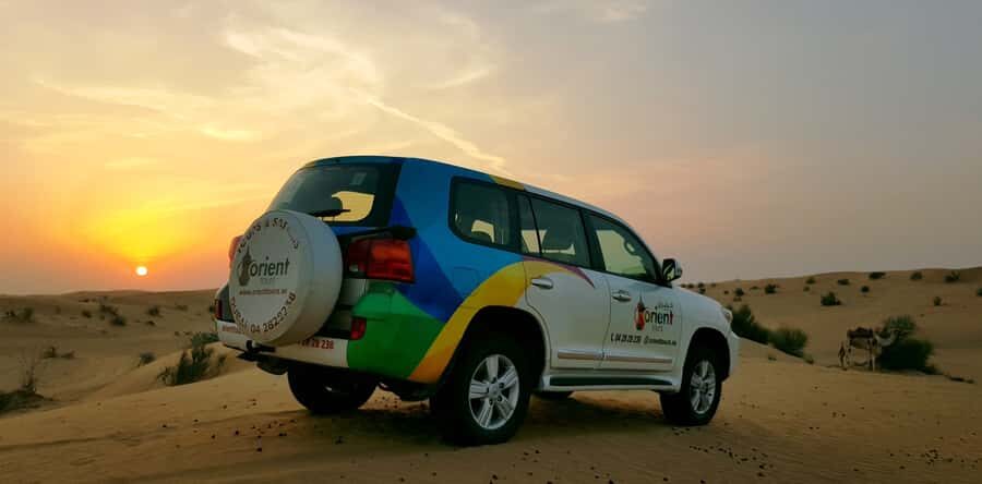 Dubai: Overnight Desert Safari with stay in Private Cabin - From hotel pickup to Lahbab Desert: the 4x4 drive and camel-farm stop