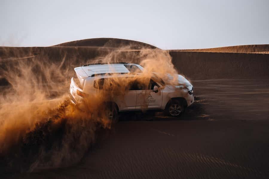 Dubai: Premium Desert Safari, Camel Ride, BBQ & Sandboarding - Red Dunes Dune Bashing at Fort Lisaili: Where the Fun Speaks Loudest