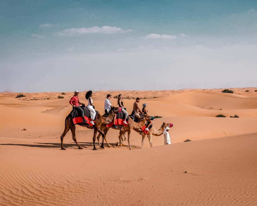 Dubai: Premium Desert Safari, Camel Ride, BBQ & Sandboarding - Sunset Viewpoint: Photos, Soft Drinks, and Golden Light