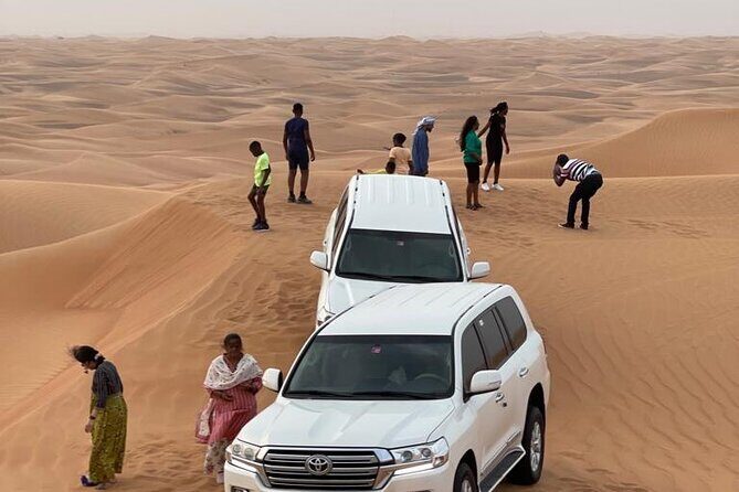 Dubai Red Dunes Afternoon Desert Safari with Camel Ride - The traditional camp setup: BBQ dinner, live shows, and henna photos