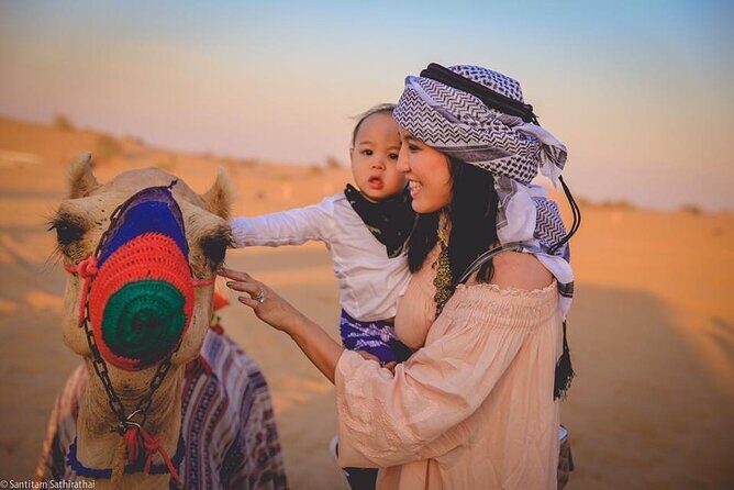 Dubai Red Dunes Desert Safari, With BBQ, Camel Ride, Sand Boarding And Much More - Bedouin Camp Welcome: Tea, Henna, Falcon Photos, and Camel Time