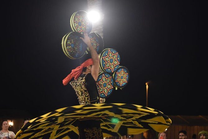 Dubai Red Dunes Quad Bike Tour,Sandboard, Camel ride & BBQ Dinner - BBQ dinner under camp lights: food and live entertainment