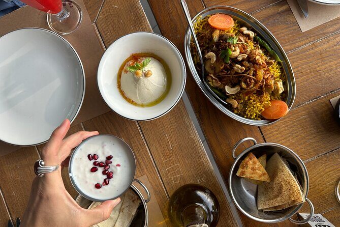 Dubai Secret Food Tours with Access to Burj Khalifa bar - At.mosphere on Floor 122: canapés, a VIP mocktail, and skyline photos