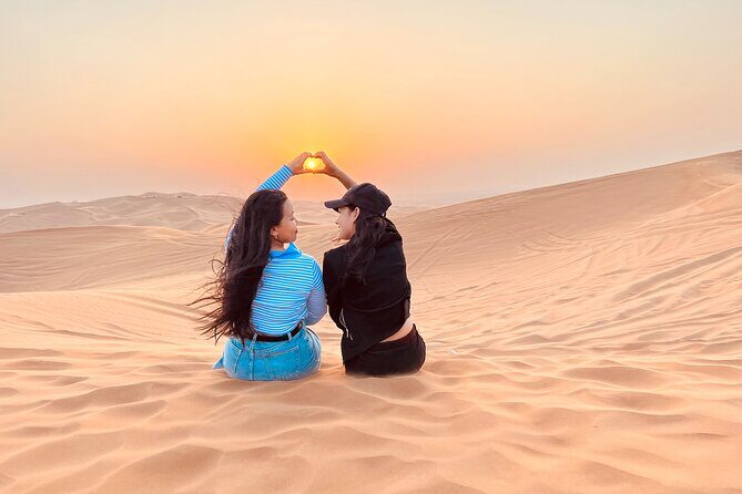 Dubai Sunrise Desert Safari Red Dune Camel Falcon & Sandboarding - The Lahbab red sand stop: tire shelter, restrooms, and reset time