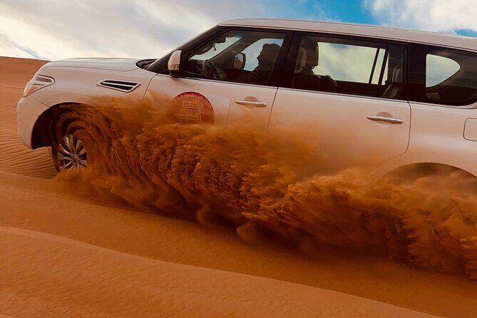 Dubai Sunrise Desert Safari Red Dune Camel Falcon & Sandboarding - Hotel pickup and the early drive into the desert