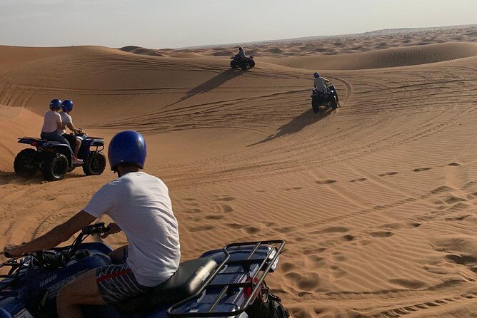 Dubai: Unique SUNSET Quad Bike Red Dunes Safari - The desert camp: BBQ buffet, henna, and folkloric entertainment