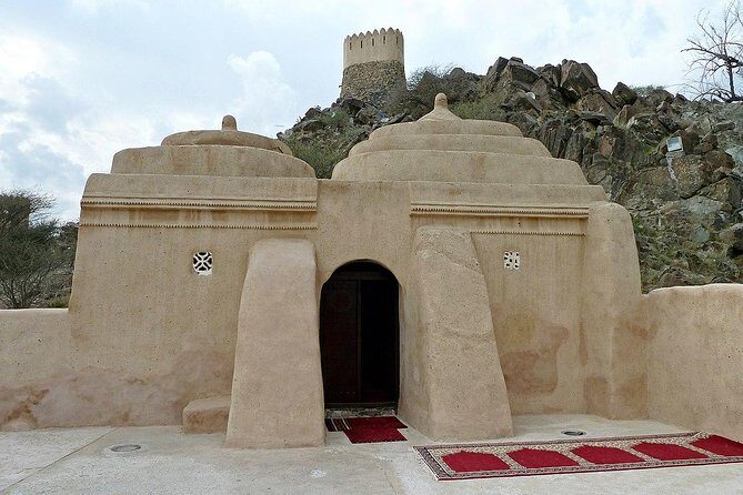 East Coast Tours - Away of Urban (Private & custom tours) - Al Badiyah Mosque: four domes, hilltop views, and farms in the distance