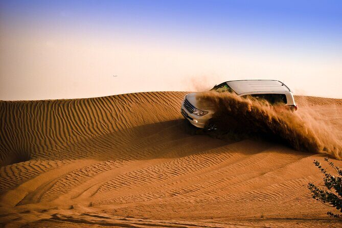 Evening Desert Safari Tour with Sand Surfing, BBQ Dinner (Exclusive Car) - Entering the desert night from your hotel, not a bus depot