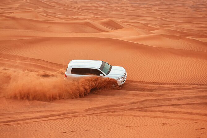 Evening Desert Safari Tour with Sand Surfing, BBQ Dinner (Exclusive Car) - Dune bashing and sand surfing: the thrill, timed and guided