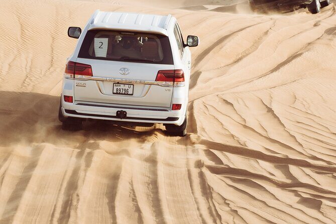 Evening Desert Safari with BBQ Dinner and Live Shows at Bedouin Camp - Desert Activities at the Camp: Camel Ride, Sandboarding, Henna