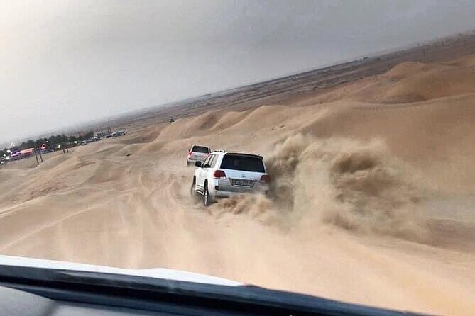Evening Desert Safari with BBQ Dinner and Live Shows - Dune Bashing + Sand Boarding + Sunset Photos: The Action Phase
