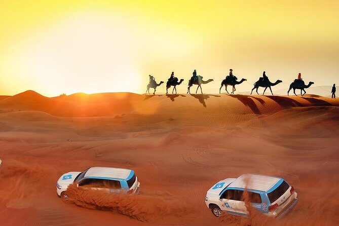 Evening Desert Safari with Camel Ride, BBQ Dinner and Dune Bashing - Lahbab dunes: dune bashing, sand boarding, and camel rides