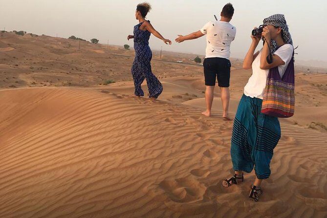 Evening Red Dunes Desert Safari: BBQ Dinner & Adventure Awaits! - Live performances: belly dancing, Tanoura, and fire dancing expectations