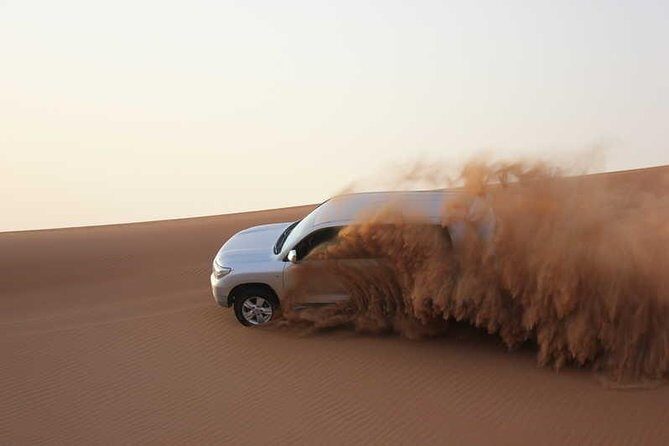 Evening Safari Quad Bike in the desert of Lahbab - Sandboarding and the sunset photo window you’ll actually remember