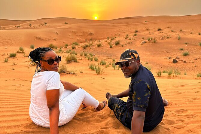 Exclusive Desert Safari Camel Ride Sandboard & Buffet BBQ Dinner - Al Aweer Desert Camp: Camel Ride, Henna, and Live Arabic Music