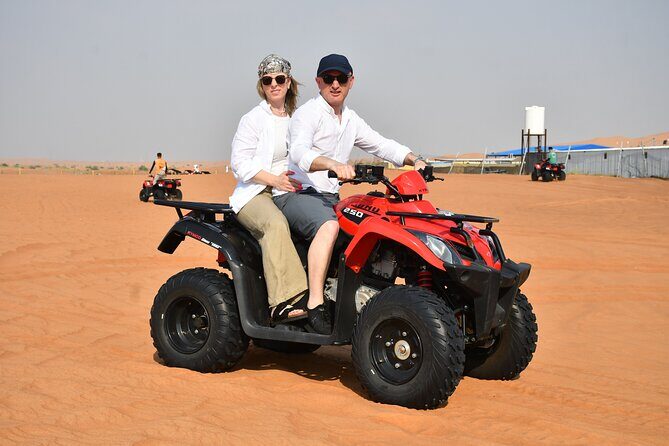 Experience Dubai Best Red Dune Evening Desert Safari BBQ Dinner - Belly dance, Tanoura, fire show, shisha lounge, and stargazing