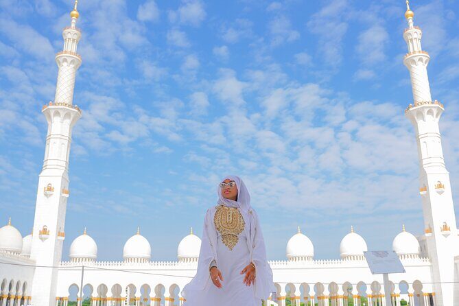 From Dubai: Abu Dhabi Day Tour with Grand Mosque & Louvre Museum - Etihad Towers, Emirates Palace, and the Corniche: fast photo stops that still work