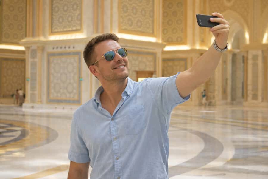 From Dubai: Abu Dhabi Day Tour with Qasr al Watan - Sheikh Zayed Grand Mosque: white marble, gold details, and dress rules