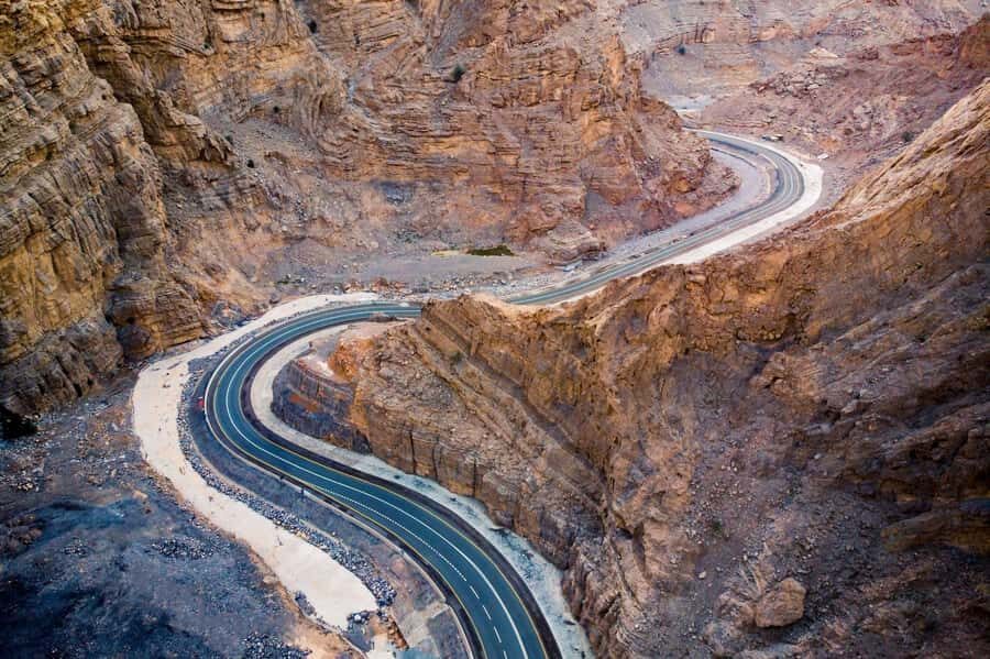 From Dubai: Jabel Jais High Mountain Tour with Transfers - Jebel Jais summit time: sunrise, off-road stops, and big photo energy
