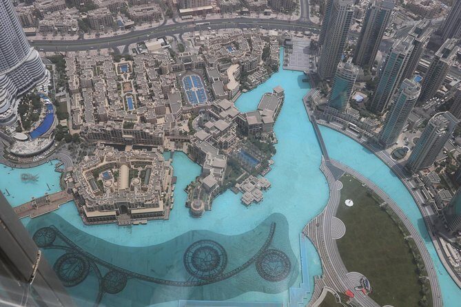 Full Day Dubai Shopping Tour with Private Transfers - Meena Bazaar in Al Fahidi: Textiles, Spices, Antiques, and Street Buzz