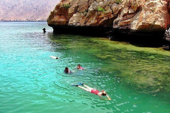 Full Day Musandam Dibba Cruise with Buffet Lunch and Snorkelling - Crossing into Oman-style cruising on a classic dhow