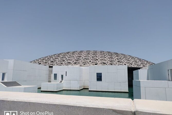 Full-Day Tour in Abu Dhabi with Pick up, Grand Mosque - Yas Marina Island quick stop: Ferrari theme park and F1 circuit views