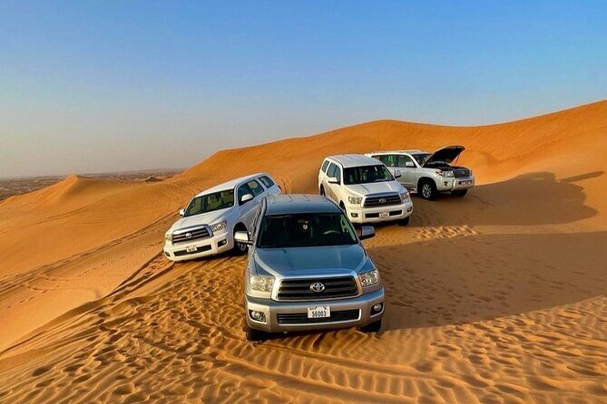 Guided Desert Safari with Dinner and Quad Biking in Dubai - Camel Riding and Sandboarding at Golden Hour