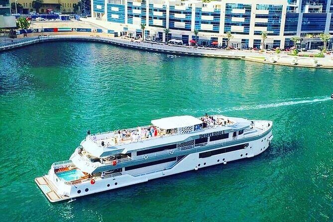 Luxury 7 Star Mega Yacht Dinner Cruise With international Buffet - Dubai Marina at night, with dinner served on water