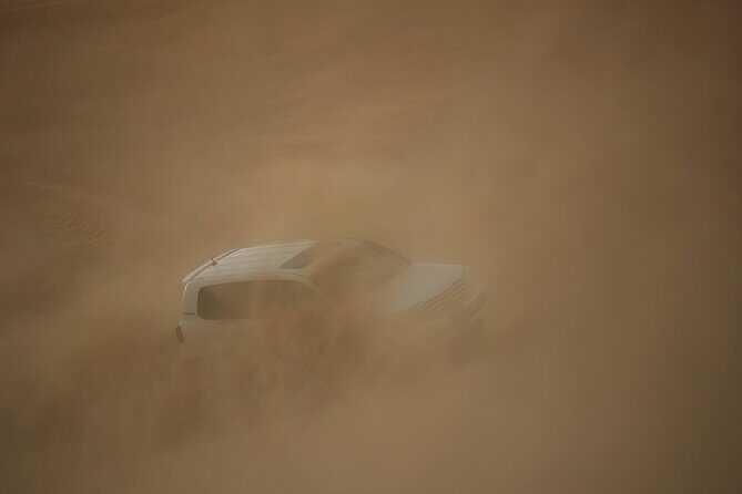 Morning Desert Safari Adventure in Abu Dhabi - Sandboarding after the speed: switching from chaos to balance