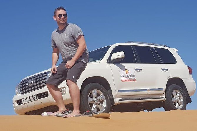 Morning Desert Safari with Camel Ride and Sandboarding - Sandboarding on the red dunes: your chance to play like a kid