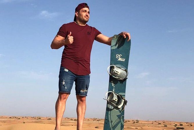 Morning Desert Safari with Camel Rides, Sand Boards and Dune Bashing - Red Dunes Action: Dune Bashing and Sandboarding Basics